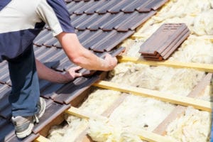 roofing companies workers laying tile